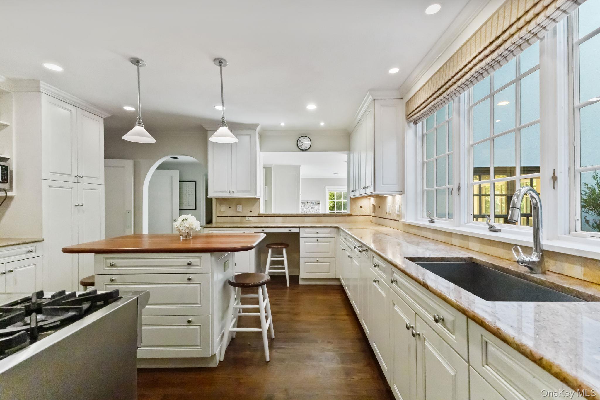 30 Studio Lane Bronxville, NY 10708 - Photo 18 of 30 a kitchen with a sink stove and cabinets