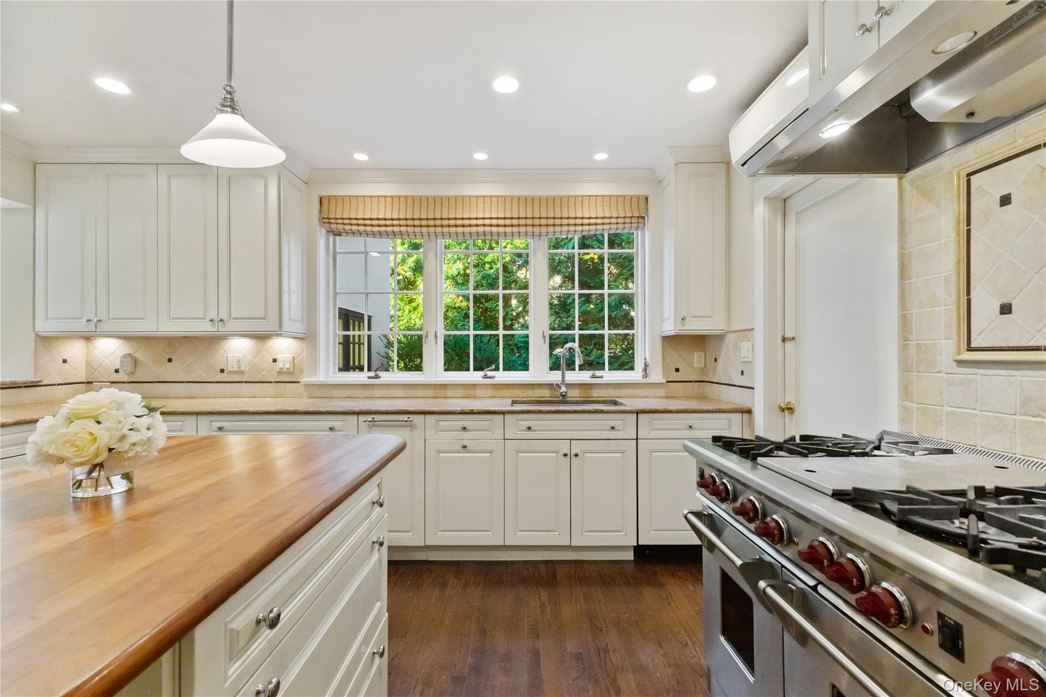 30 Studio Lane Bronxville, NY 10708 - Photo 19 of 30 a kitchen with a sink stove and cabinets