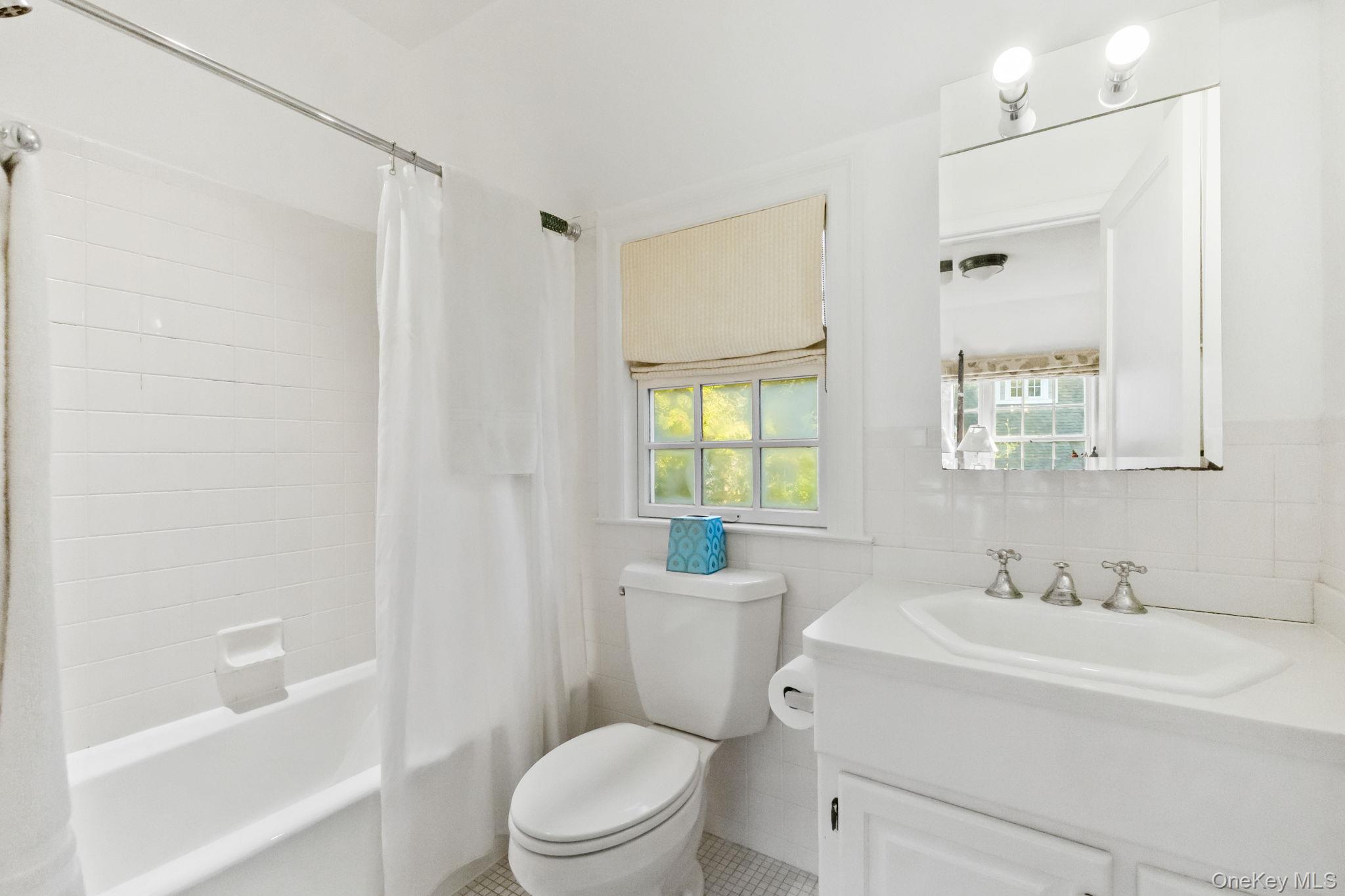 30 Studio Lane Bronxville, NY 10708 - Photo 26 of 30 a bathroom with a sink a toilet and shower