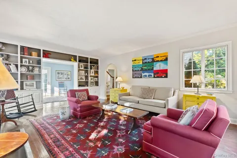 a living room with furniture or couch and a large window