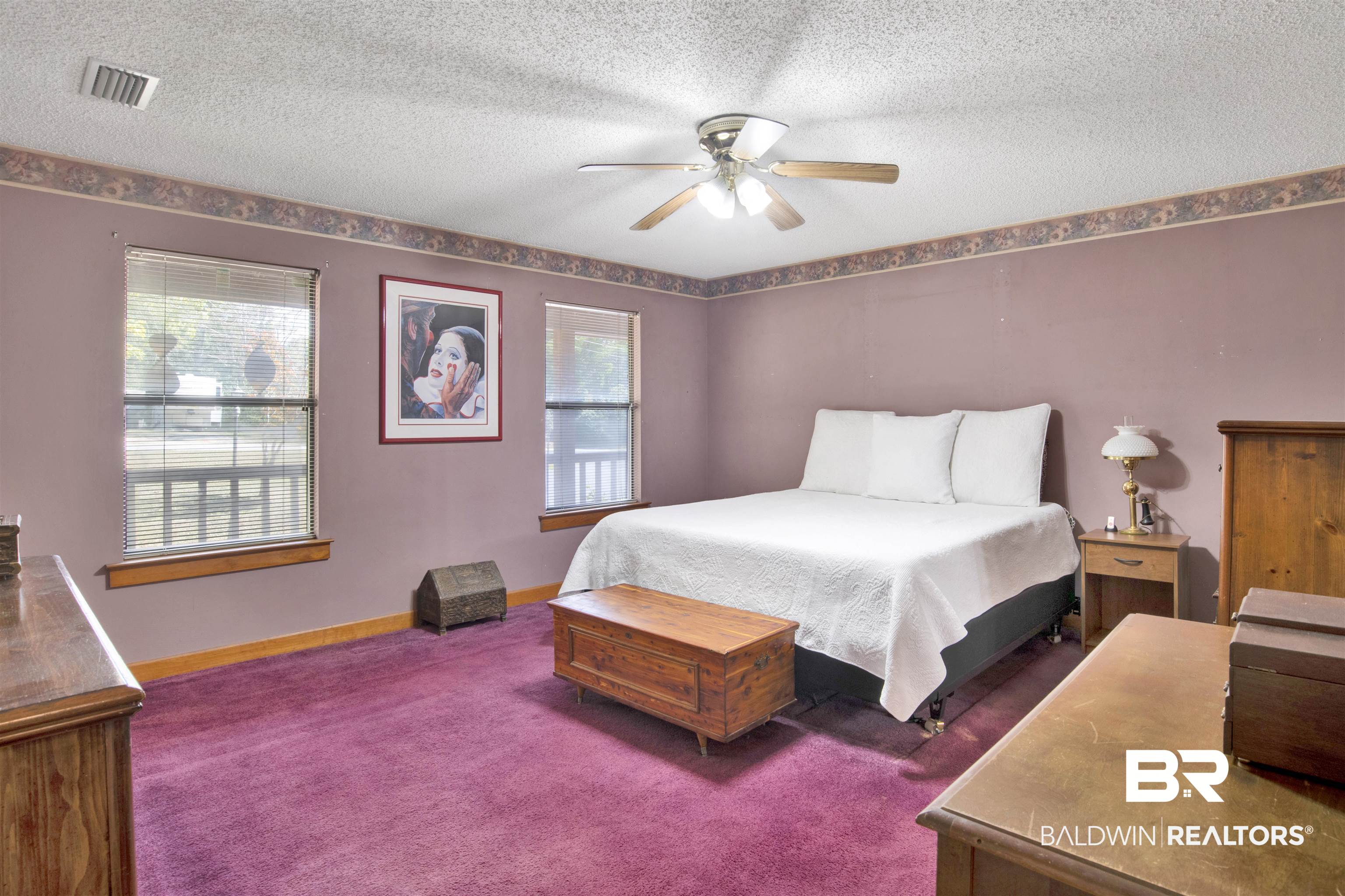 4890 Red Creek Road Semmes, AL 36575 - Photo 18 of 47 Bedroom featuring multiple windows, a textured ceiling, carpet flooring, and ceiling fan