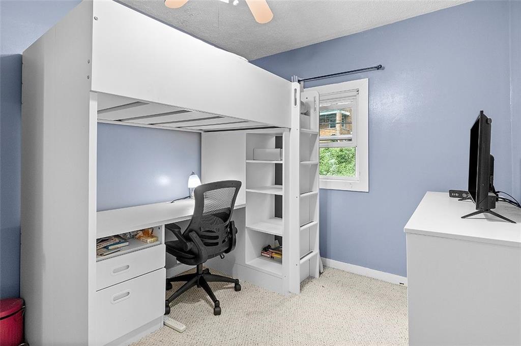 33 Radium Street Pittsburgh, PA 15214 - Photo 18 of 31 a view of a workspace with furniture and a window