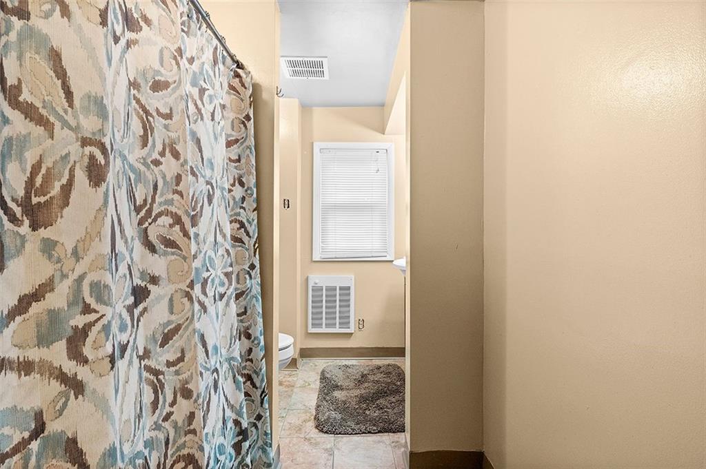 33 Radium Street Pittsburgh, PA 15214 - Photo 20 of 31 a bathroom with a granite countertop shower and a window