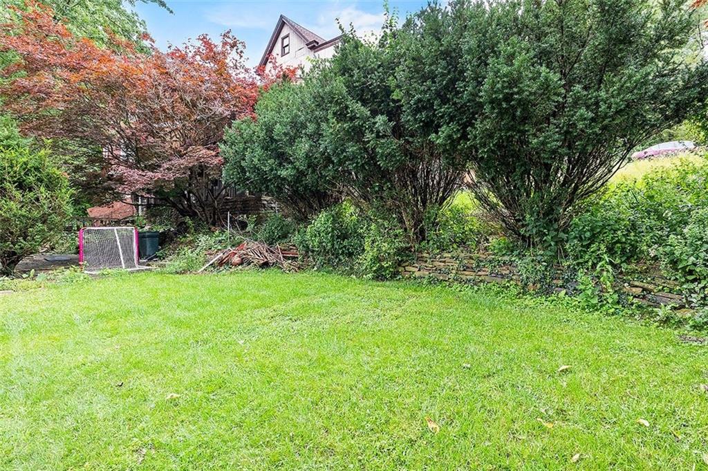 33 Radium Street Pittsburgh, PA 15214 - Photo 22 of 31 a backyard of a house with lots of green space