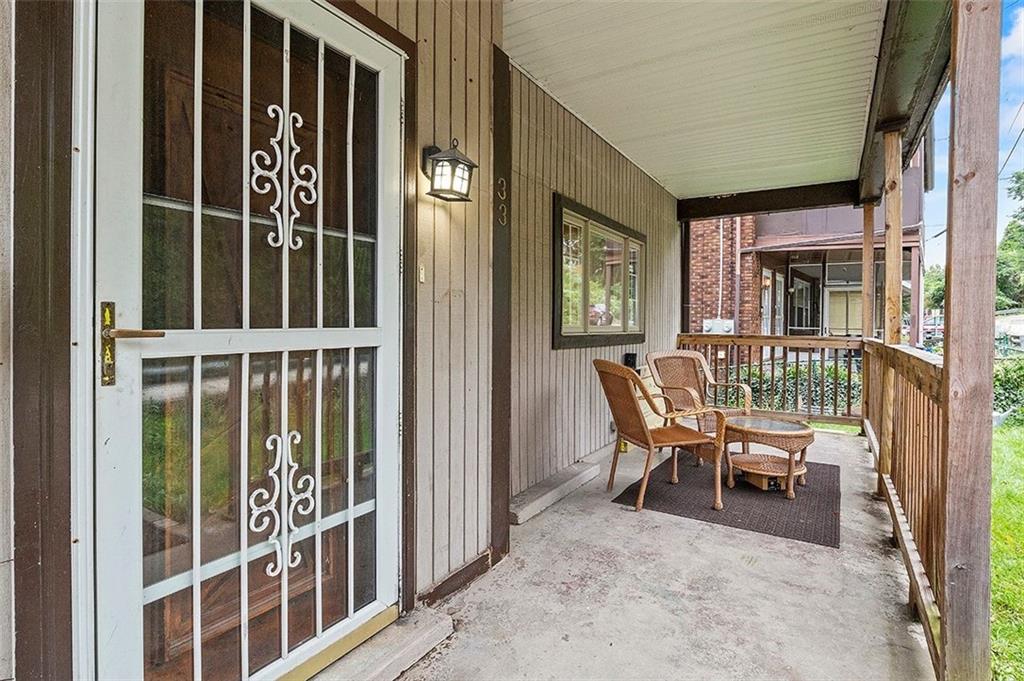33 Radium Street Pittsburgh, PA 15214 - Photo 23 of 31 a balcony with table and chairs