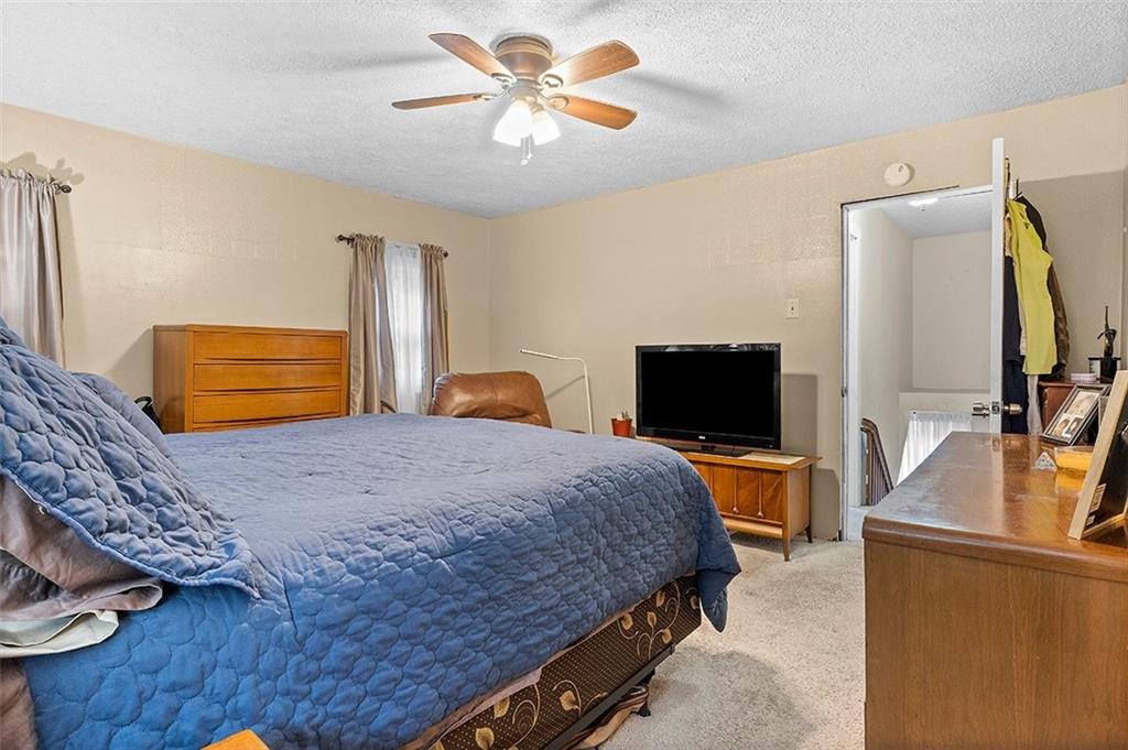 33 Radium Street Pittsburgh, PA 15214 - Photo 24 of 31 a bedroom with a bed and a flat screen tv