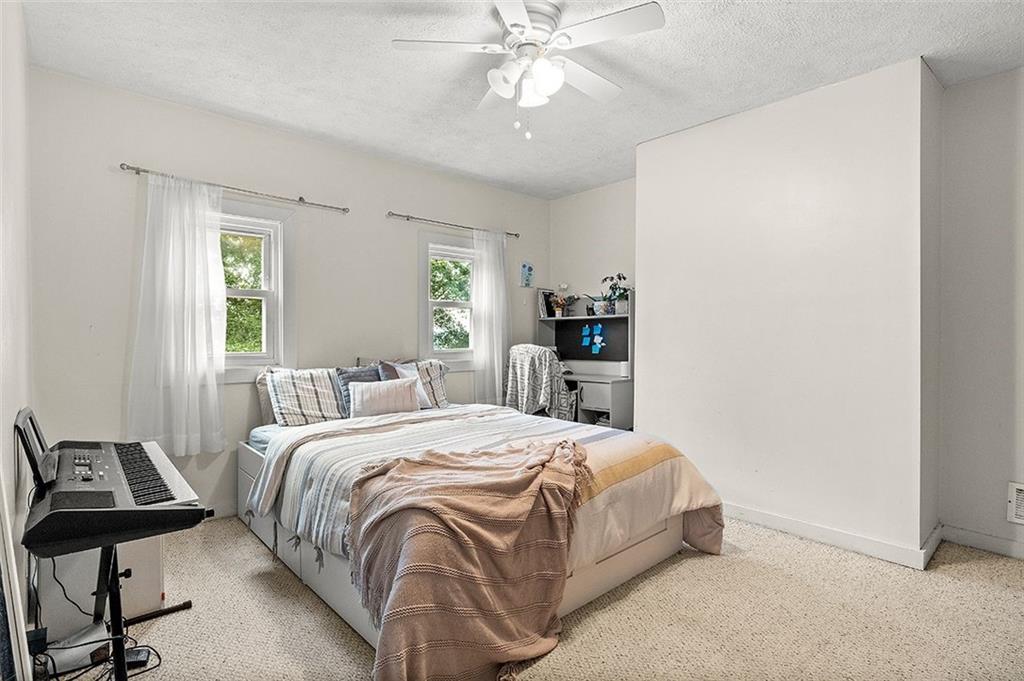 33 Radium Street Pittsburgh, PA 15214 - Photo 26 of 31 a bedroom with a bed and window