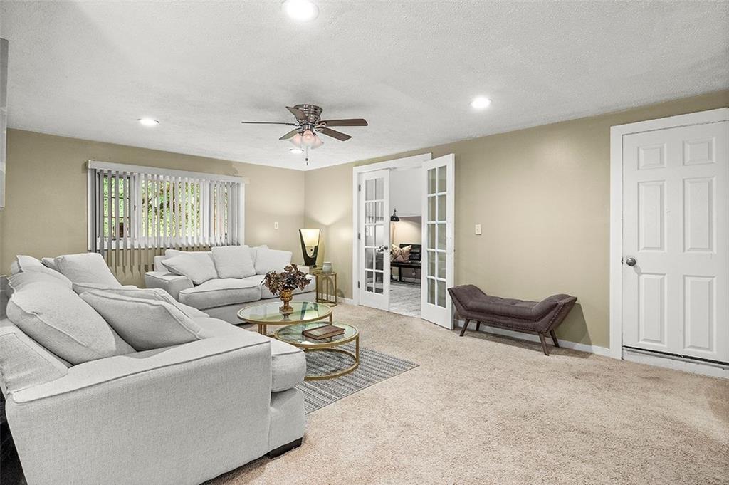 33 Radium Street Pittsburgh, PA 15214 - Photo 3 of 31 a living room with furniture and a ceiling fan