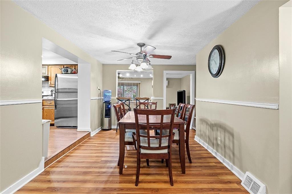 33 Radium Street Pittsburgh, PA 15214 - Photo 6 of 31 a view of a dining room with furniture and wooden floor
