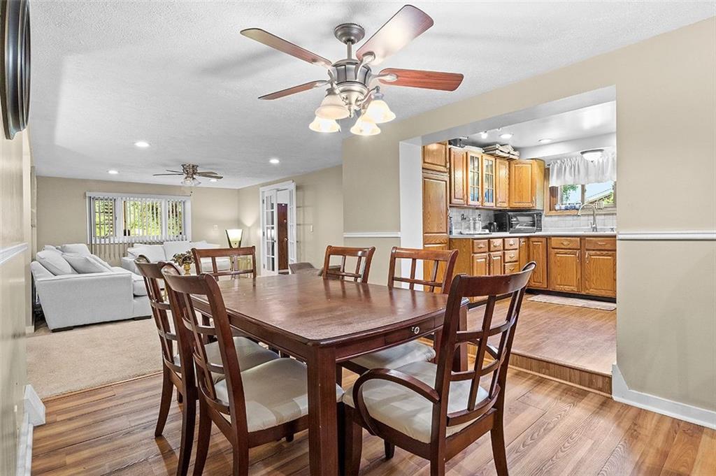 33 Radium Street Pittsburgh, PA 15214 - Photo 7 of 31 a view of a dining room with furniture and wooden floor