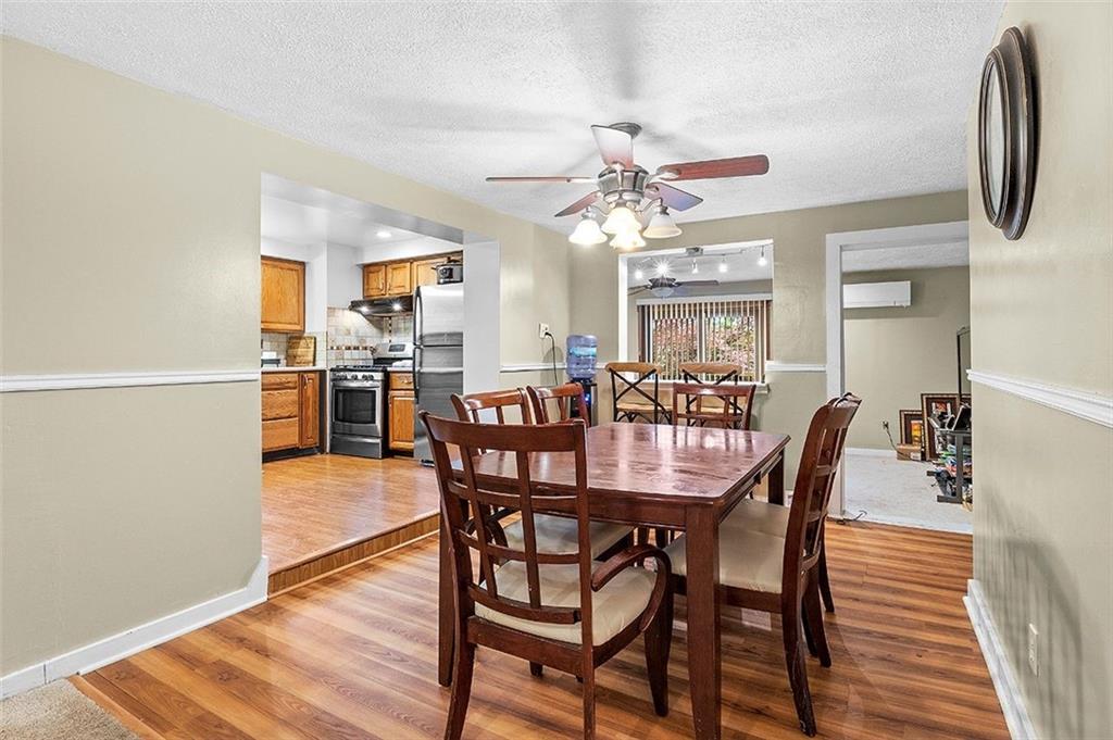 33 Radium Street Pittsburgh, PA 15214 - Photo 8 of 31 a view of a dining room with furniture and wooden floor