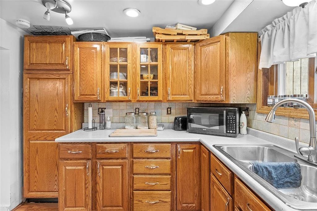 33 Radium Street Pittsburgh, PA 15214 - Photo 10 of 31 a kitchen with stainless steel appliances granite countertop a sink stove and cabinets