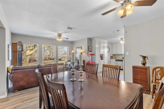 a kitchen with a refrigerator a sink and dishwasher a refrigerator with wooden floor