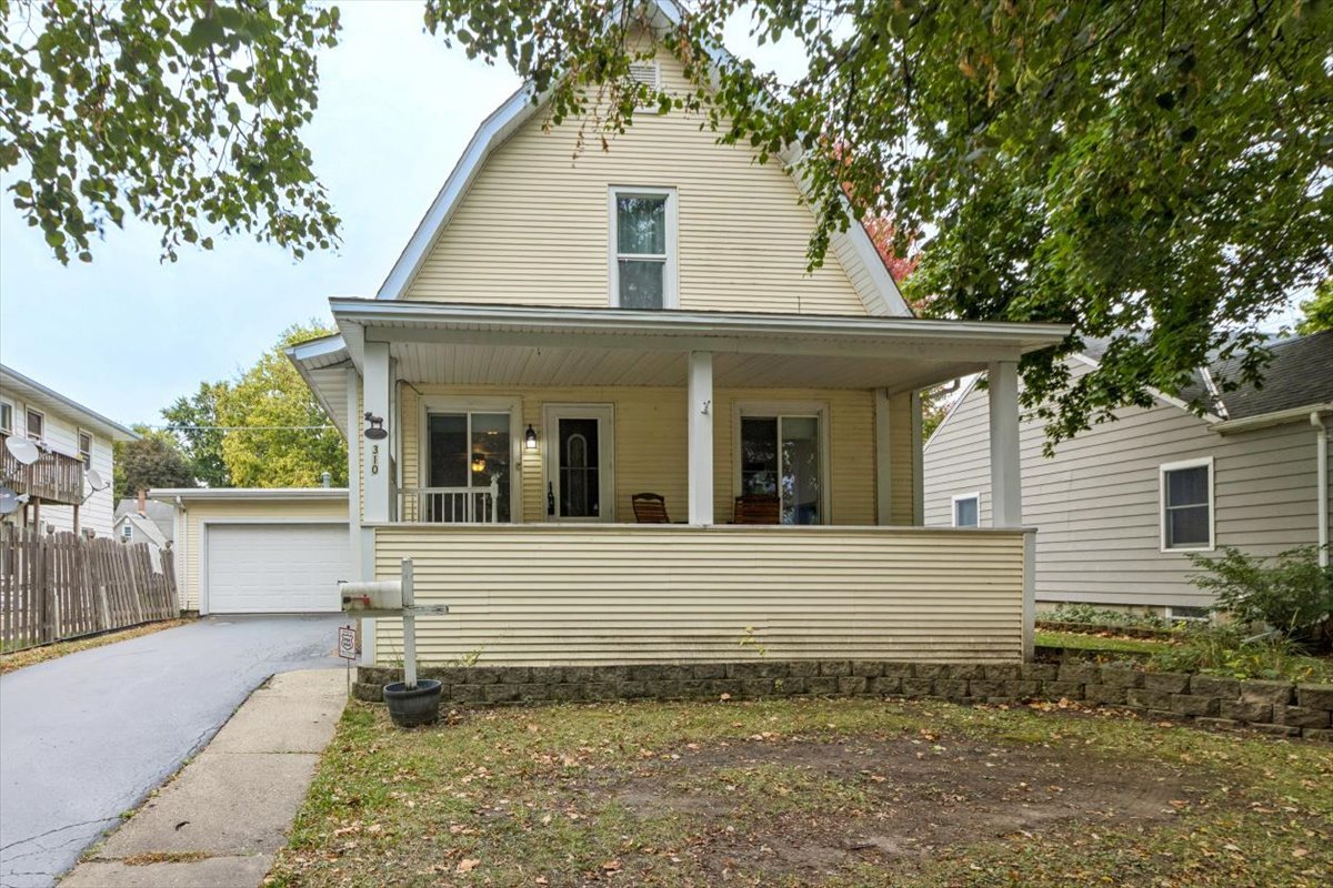 310 South Sycamore Street Genoa, IL 60135 - Photo 1 of 21 a view of a house with a yard