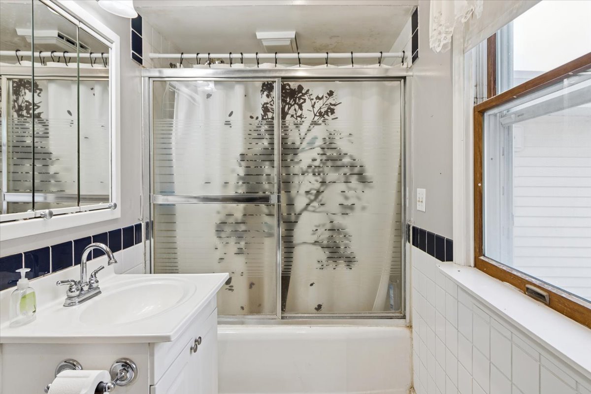 310 South Sycamore Street Genoa, IL 60135 - Photo 12 of 21 a bathroom with a sink and a mirror
