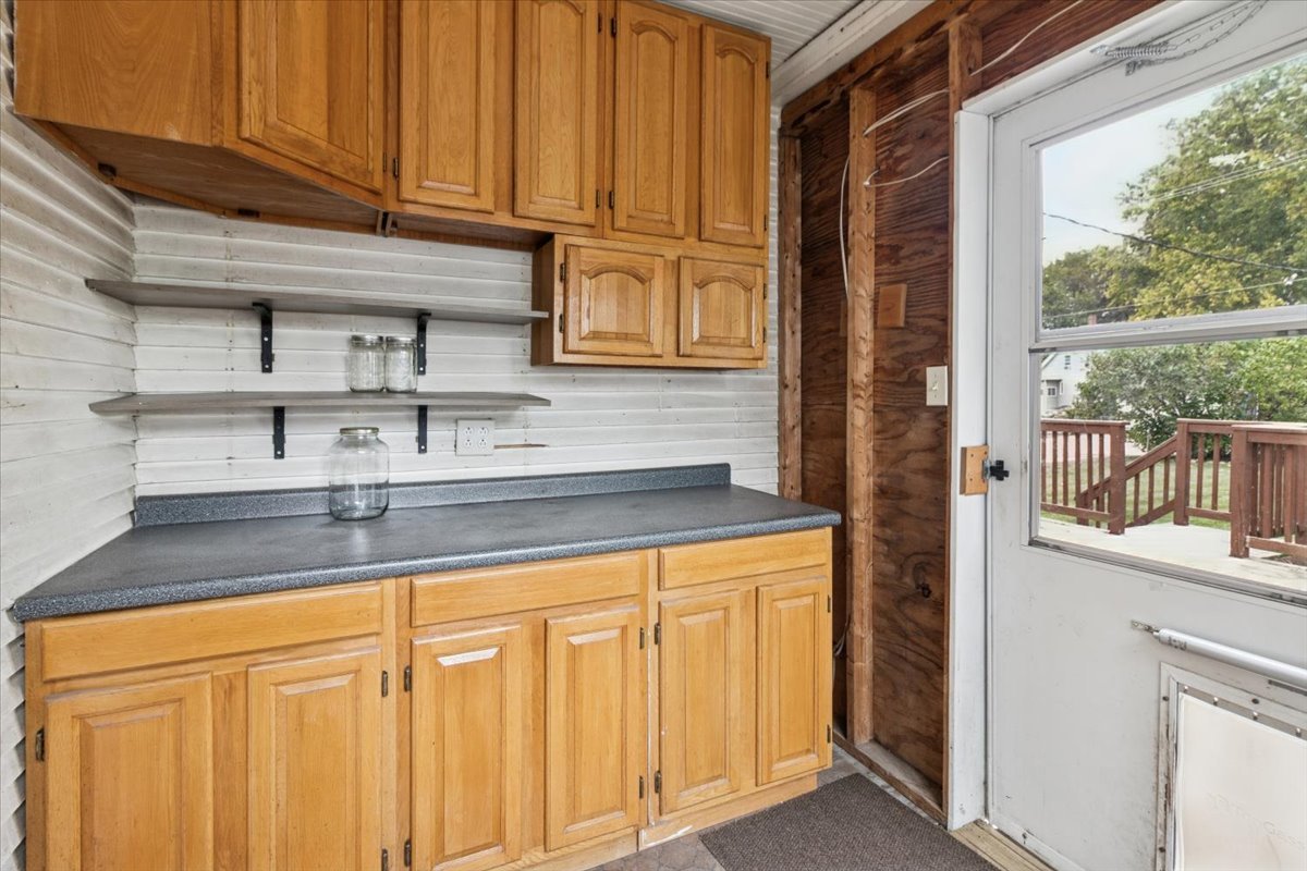310 South Sycamore Street Genoa, IL 60135 - Photo 13 of 21 a kitchen with stainless steel appliances granite countertop a refrigerator and a sink