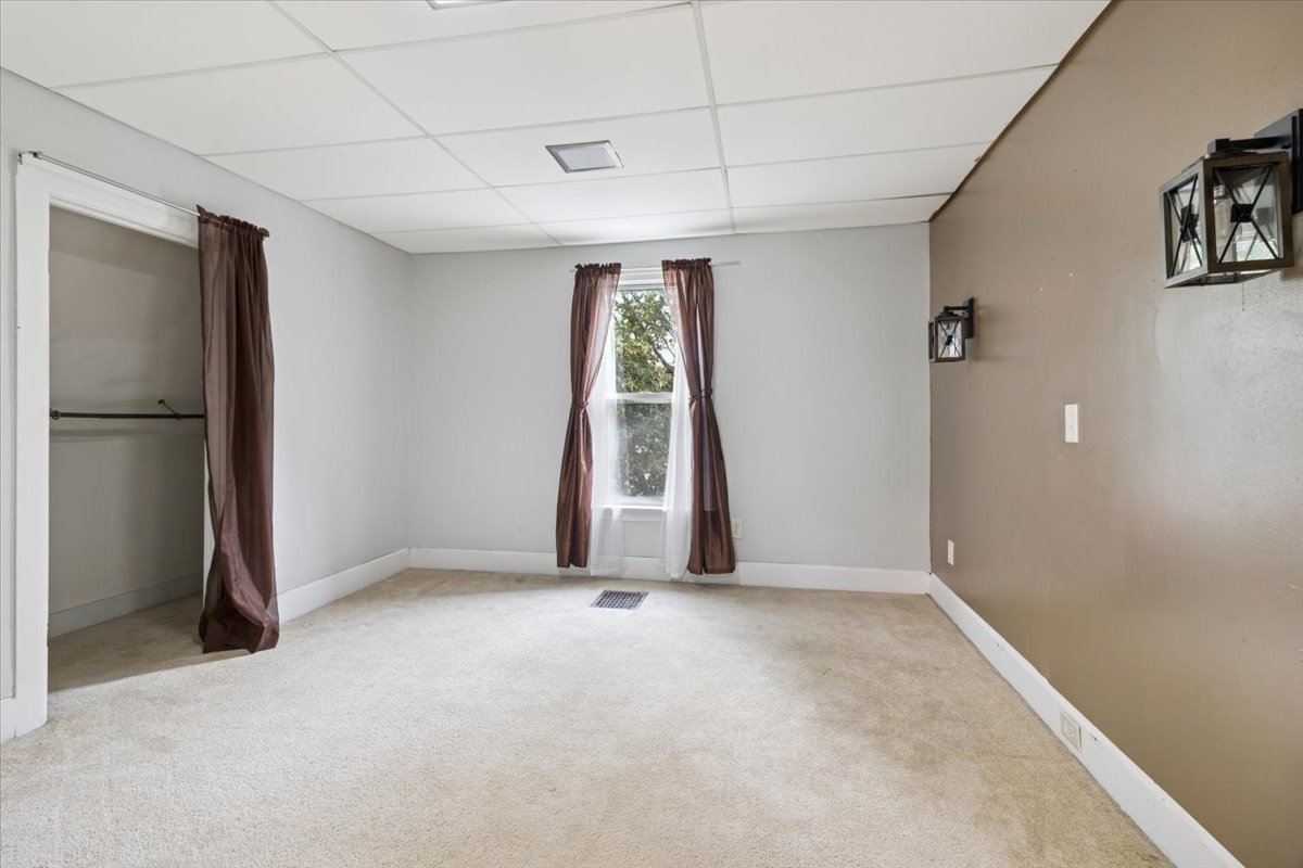 310 South Sycamore Street Genoa, IL 60135 - Photo 14 of 21 a view of an empty room with a window