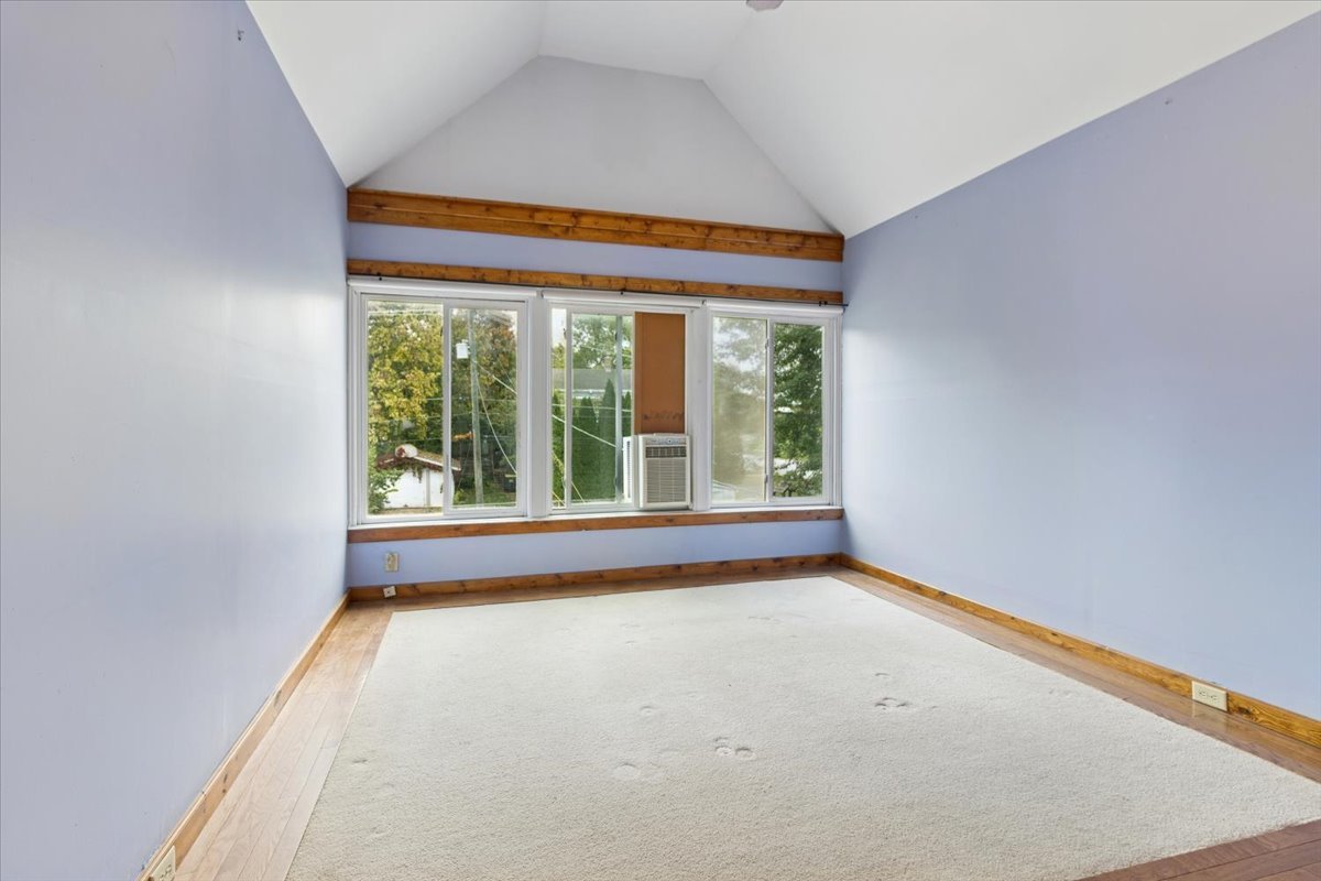 310 South Sycamore Street Genoa, IL 60135 - Photo 15 of 21 a view of an empty room with a window