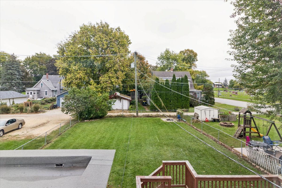 310 South Sycamore Street Genoa, IL 60135 - Photo 18 of 21 a view of a garden with a slide