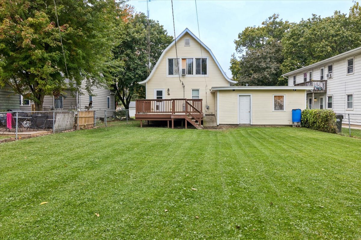 310 South Sycamore Street Genoa, IL 60135 - Photo 19 of 21 a view of a house with a yard and sitting area
