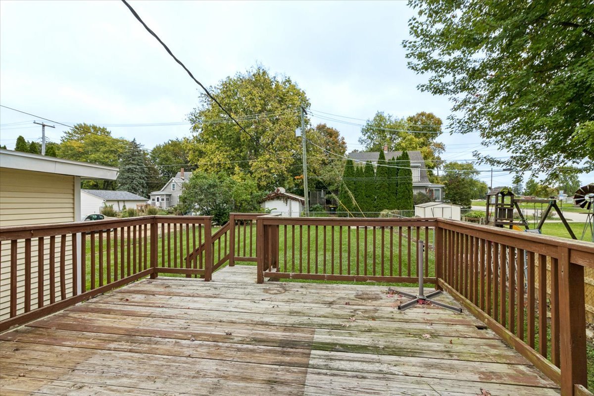 310 South Sycamore Street Genoa, IL 60135 - Photo 21 of 21 a view of a wooden roof deck