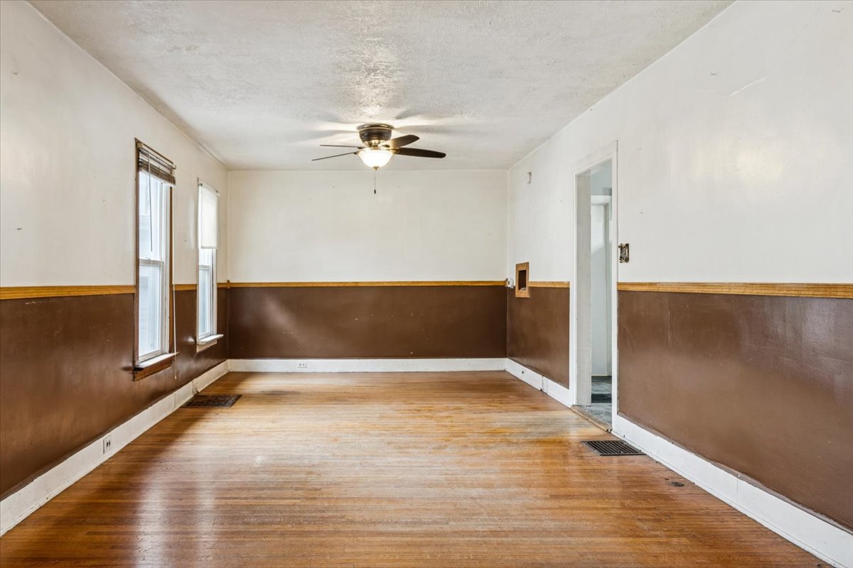310 South Sycamore Street Genoa, IL 60135 - Photo 6 of 21 a view of an empty room with a window