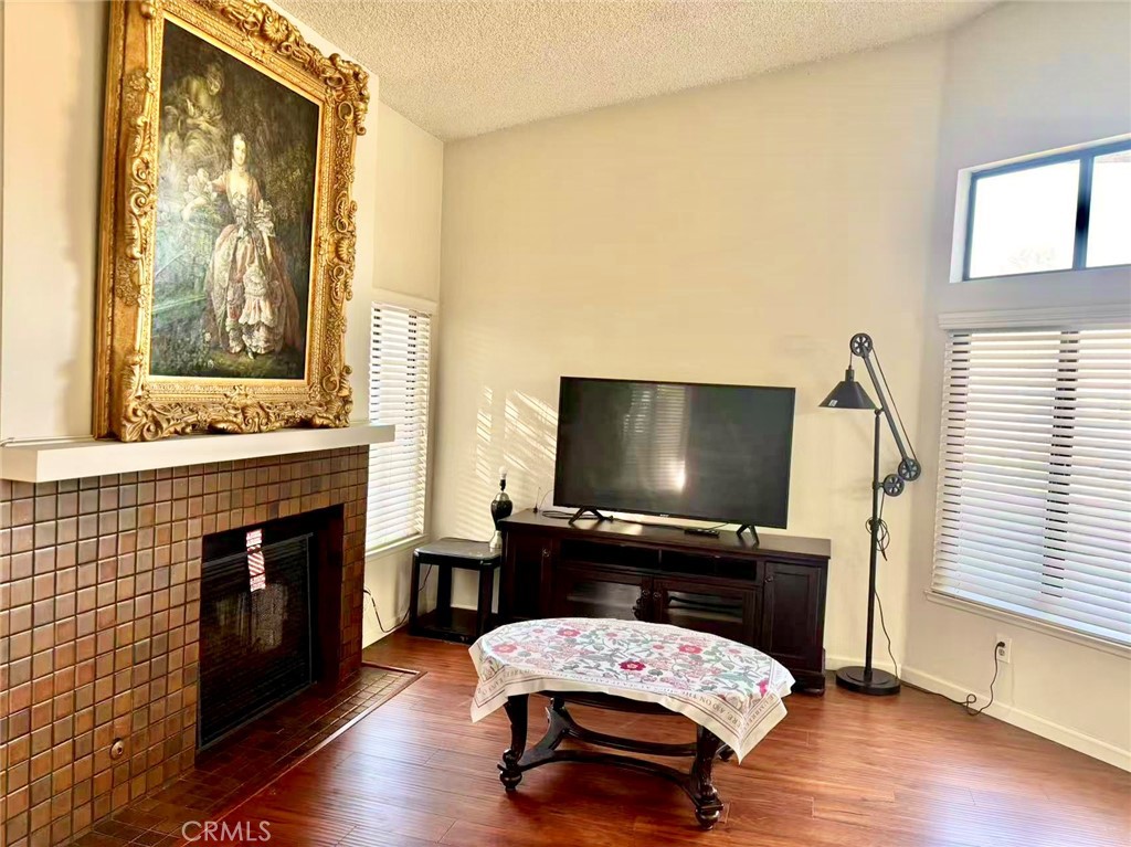 18 Town And Country Road, Unit 34 Pomona, CA 91766 - Photo 2 of 26 a living room with furniture and a flat screen tv