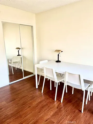 a view of a dining room with wooden floor