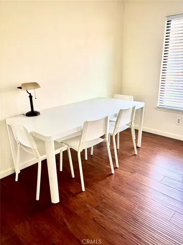 a view of dining room and wooden floor