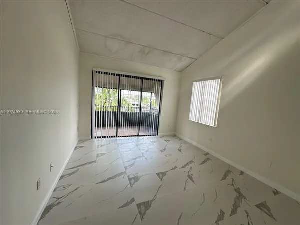 an empty room with windows