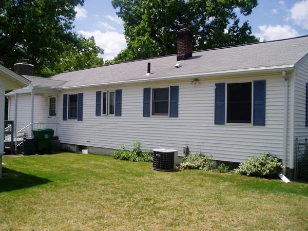 387 Granby Road Chicopee, MA 01013 - Photo 4 of 22 a front view of a house with a yard