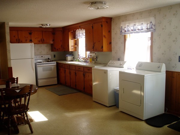 387 Granby Road Chicopee, MA 01013 - Photo 5 of 22 a kitchen with cabinets a sink and a stove top oven