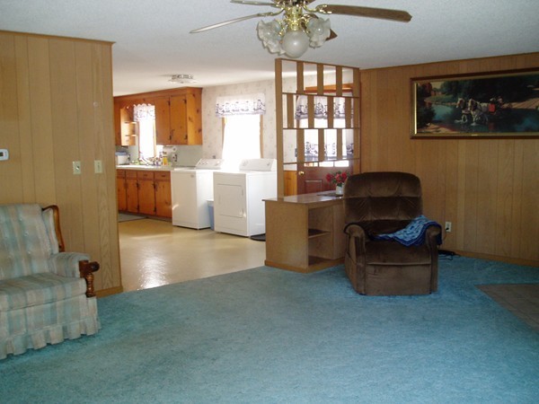 387 Granby Road Chicopee, MA 01013 - Photo 6 of 22 a living room with furniture and a chandelier
