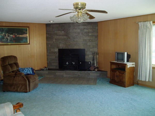 387 Granby Road Chicopee, MA 01013 - Photo 7 of 22 a living room with furniture and a fireplace