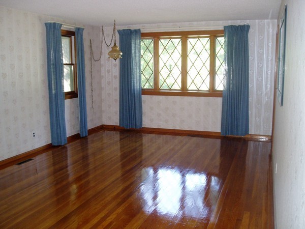 387 Granby Road Chicopee, MA 01013 - Photo 9 of 22 a view of empty room with wooden floor and fan