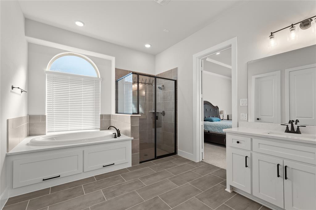 600 St Andrew Lane Prosper, TX 75078 - Photo 18 of 29 Full bathroom featuring connected bathroom, vanity, a stall shower, and a bath