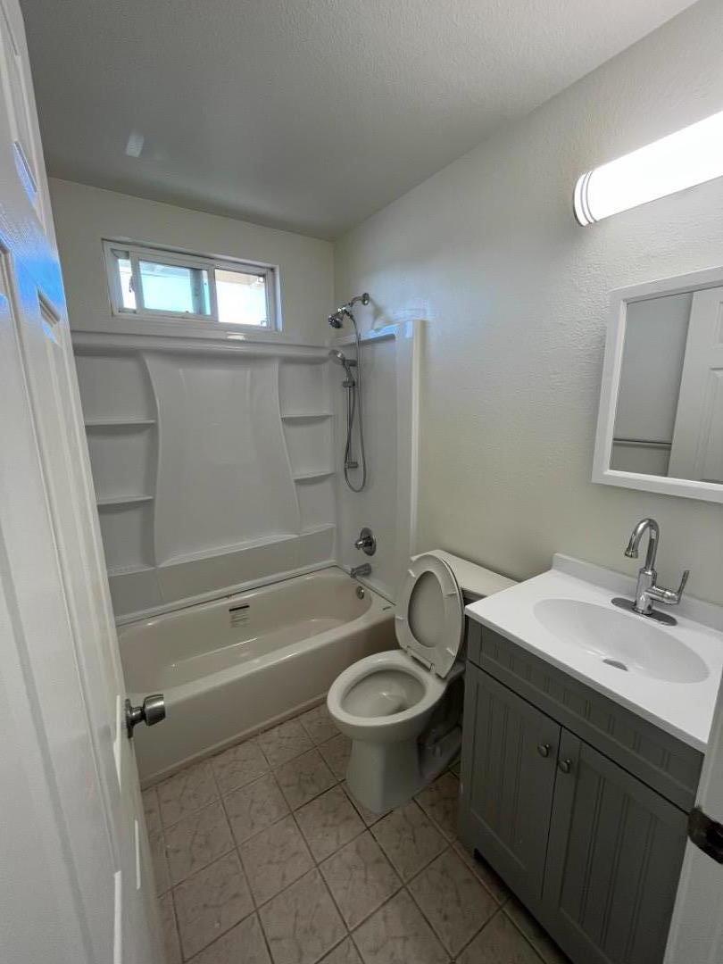 591 Nello Drive, Unit 4 Campbell, CA 95008 - Photo 21 of 33 a bathroom with a sink a toilet and shower