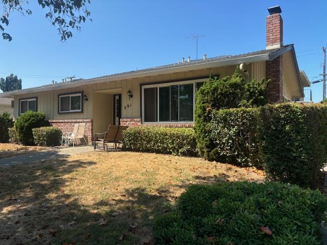 591 Nello Drive, Unit 4 Campbell, CA 95008 - Photo 32 of 33 a front view of house with yard and trees around