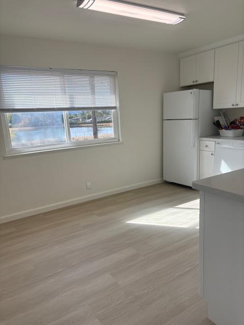 591 Nello Drive, Unit 4 Campbell, CA 95008 - Photo 6 of 33 a view of a refrigerator in kitchen and wooden floor