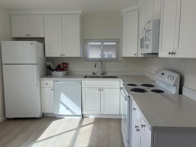 591 Nello Drive, Unit 4 Campbell, CA 95008 - Photo 8 of 33 a kitchen with a sink a stove a refrigerator and cabinets