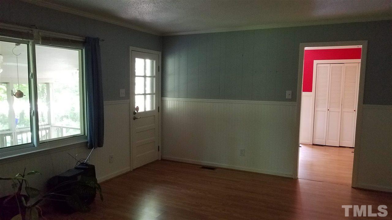 1602 Goodwin Road Durham, NC 27712 - Photo 12 of 13 Den with wood burning fireplace