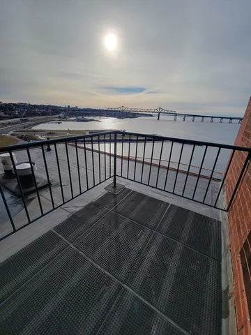 a view of balcony with wooden floor