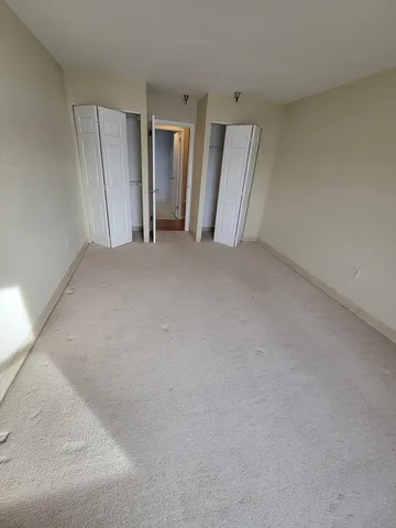 a view of a room that has a window in it