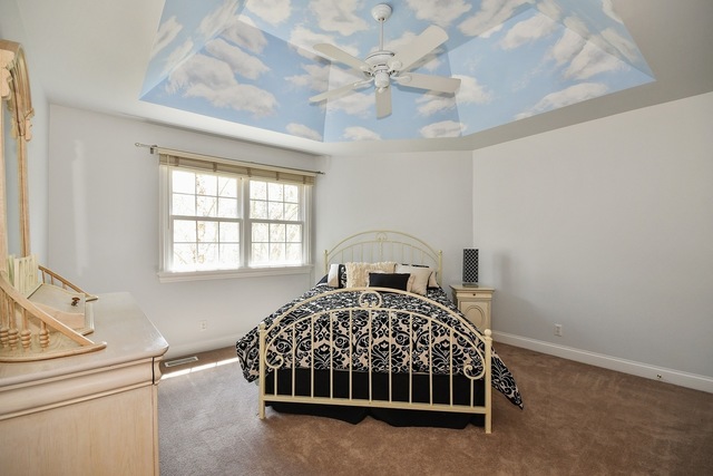 37W571 Grey Barn Road St. Charles, IL 60175 - Photo 15 of 31 a bed sitting in a bedroom next to a window