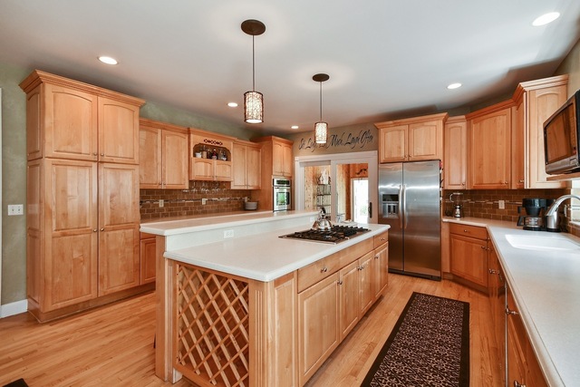 37W571 Grey Barn Road St. Charles, IL 60175 - Photo 5 of 31 a kitchen with stainless steel appliances granite countertop a sink a stove a refrigerator and cabinets