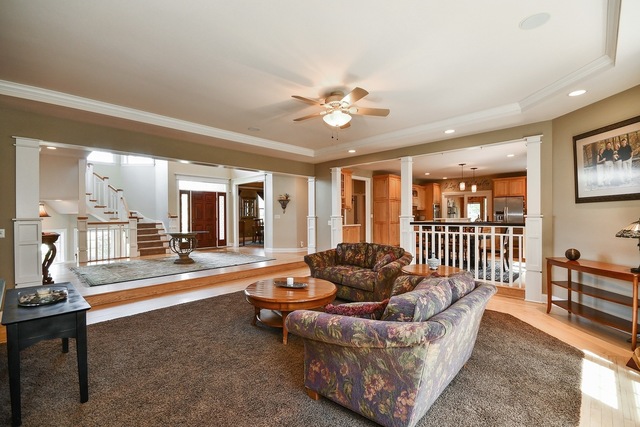 37W571 Grey Barn Road St. Charles, IL 60175 - Photo 9 of 31 a living room with furniture and a table with wooden floor