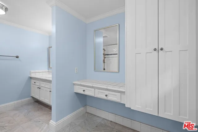 a view of room and bathroom