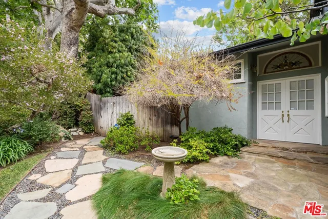 a view of a garden with a fountain