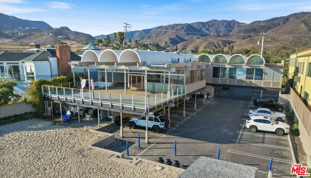 an aerial view of a house with a garden
