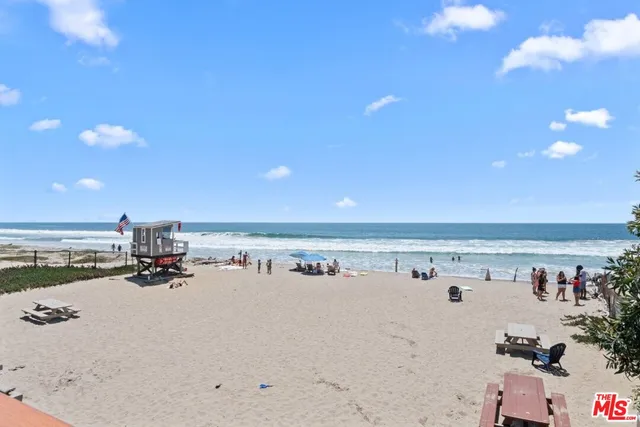 view of living room with furniture and floor to ceiling window